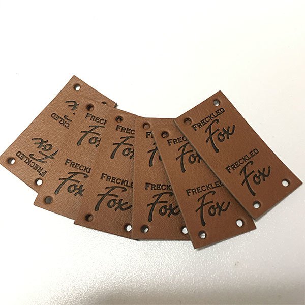 棕色PU皮革牛仔褲標籤
